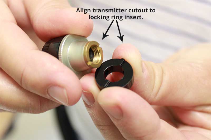 Make sure the locking ring insert is aligned to the transmitter's bottom cutout.